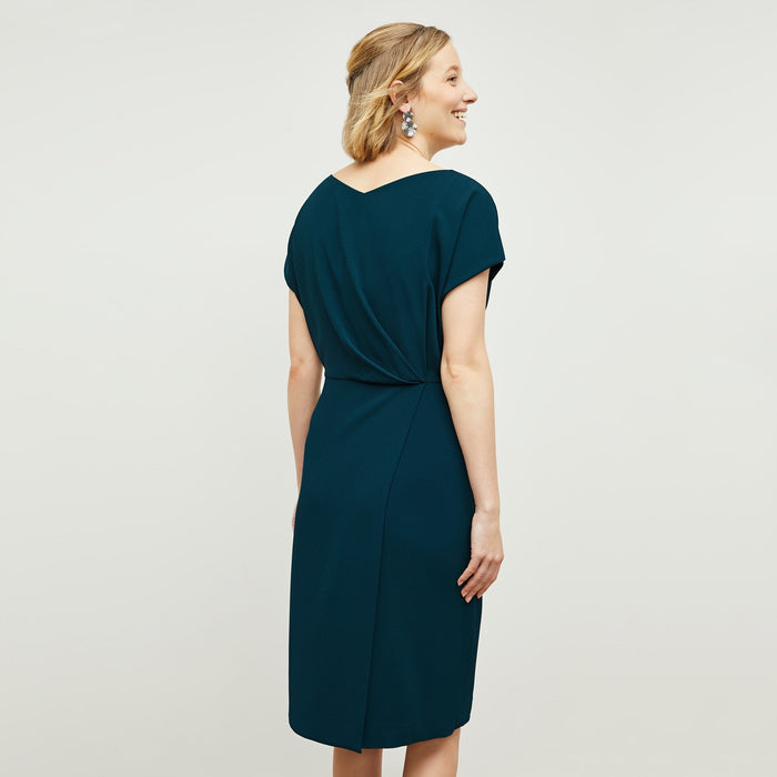 Back image of a woman standing wearing the Jillian Dress in Rainforest