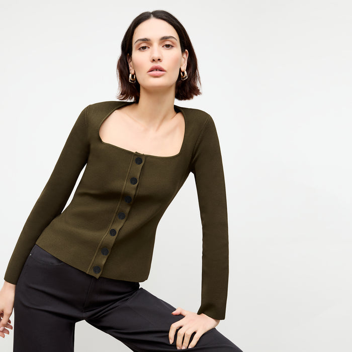front image of a woman wearing the jin jardigan in dark elm