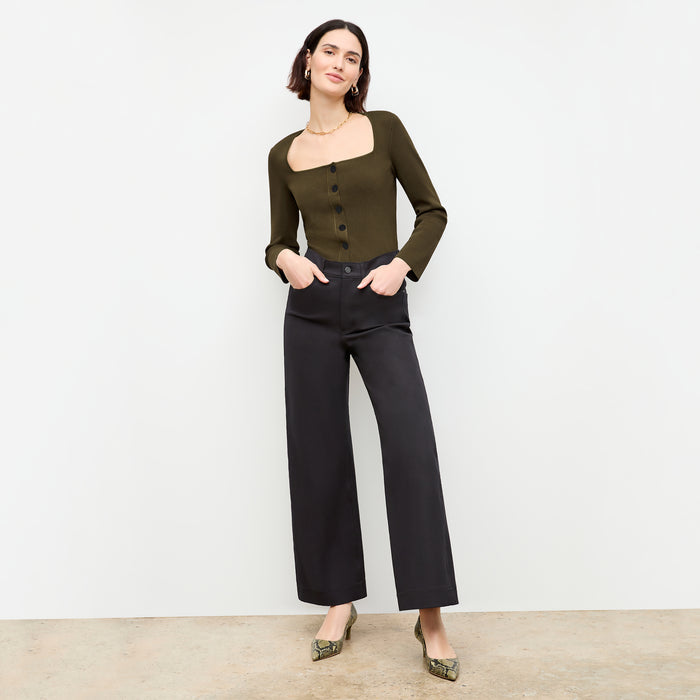 front image of a woman wearing the jin jardigan in dark elm