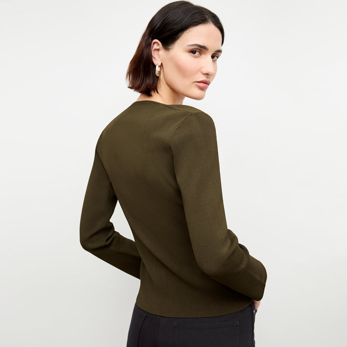 back image of a woman wearing the jin jardigan in dark elm