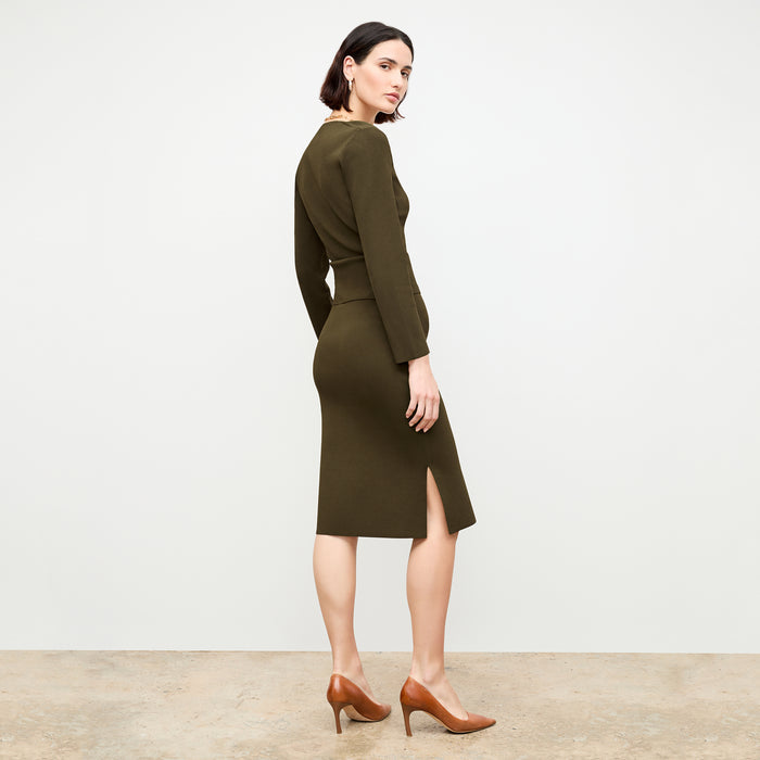 back image of a woman wearing the jin top in dark elm