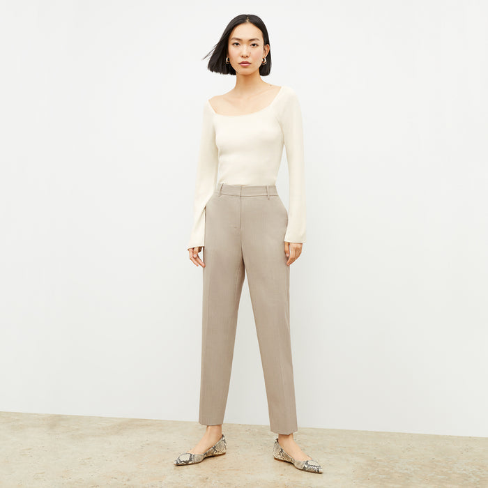 Front image of a woman wearing the Joya Top in Cream