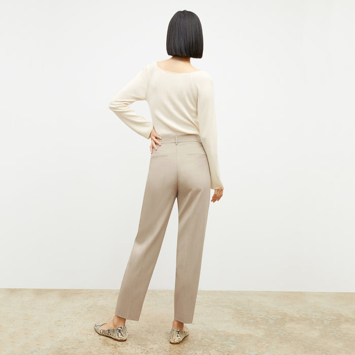 Back image of a woman wearing the Joya Top in Cream