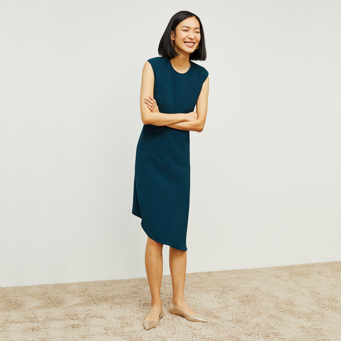 Front image of a woman standing wearing the Lara Dress in Rainforest | Lead