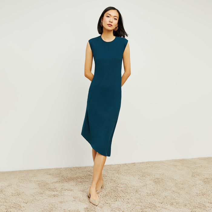 Front image of a woman standing wearing the Lara Dress in Rainforest