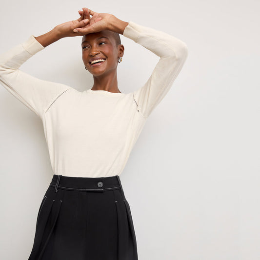 front image of a woman wearing the larissa sweater in ivory | Lead