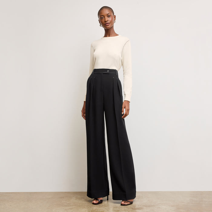 front image of a woman wearing the larissa sweater in ivory