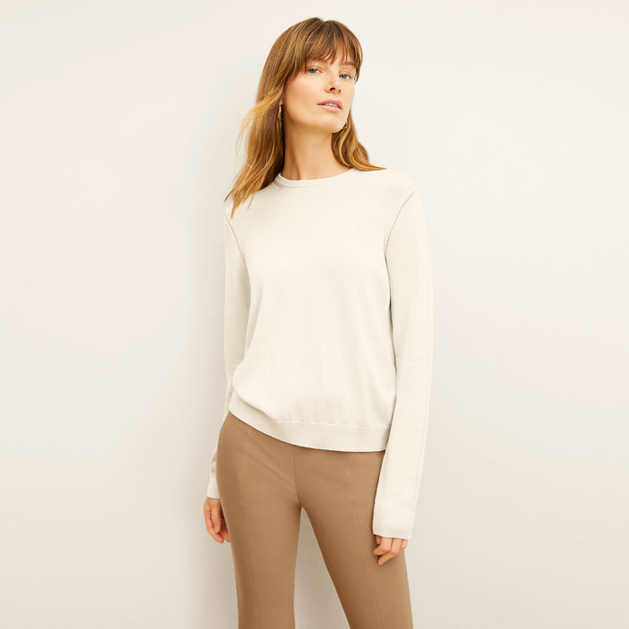 front image of a woman wearing the larissa sweater in ivory | Lead