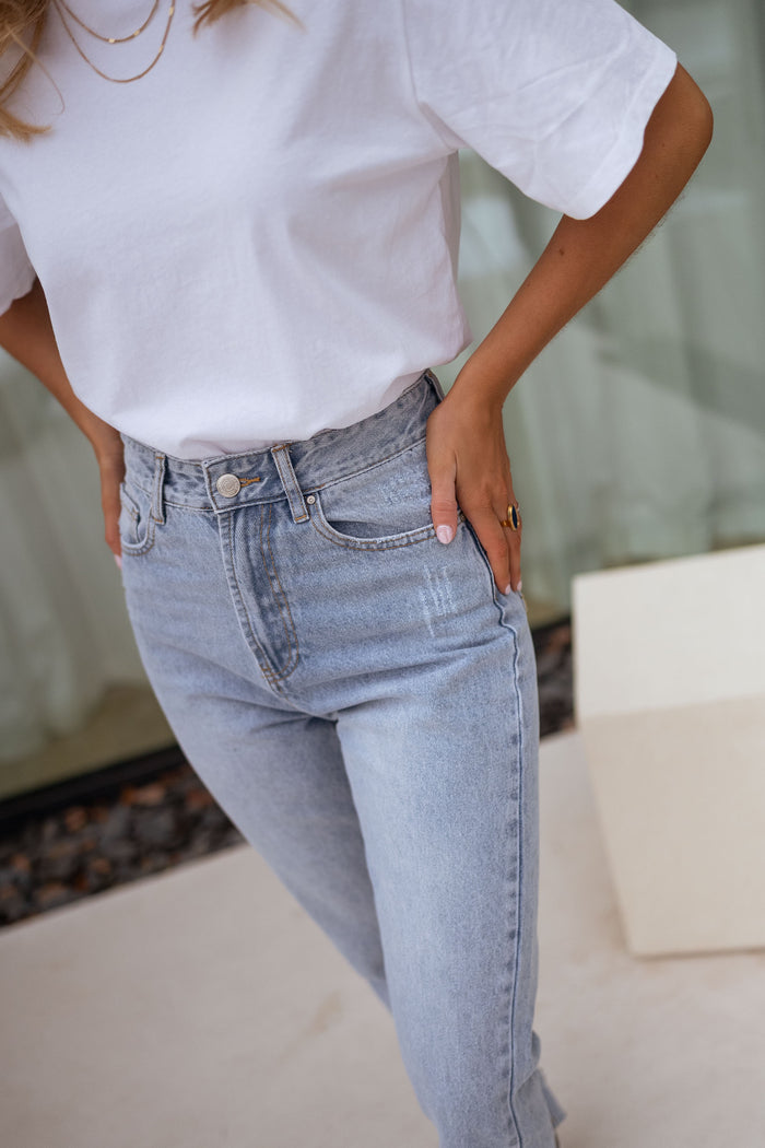 Light blue Hunter denim raw hem close-up