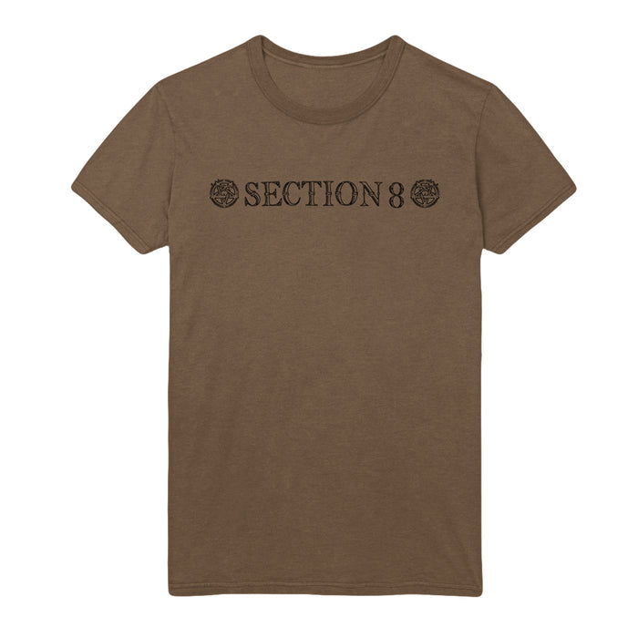 Section 8 brown t-shirt featuring SECTION 8 in bold black capitals on the chest, bordered by two circular designs on either side of the text.