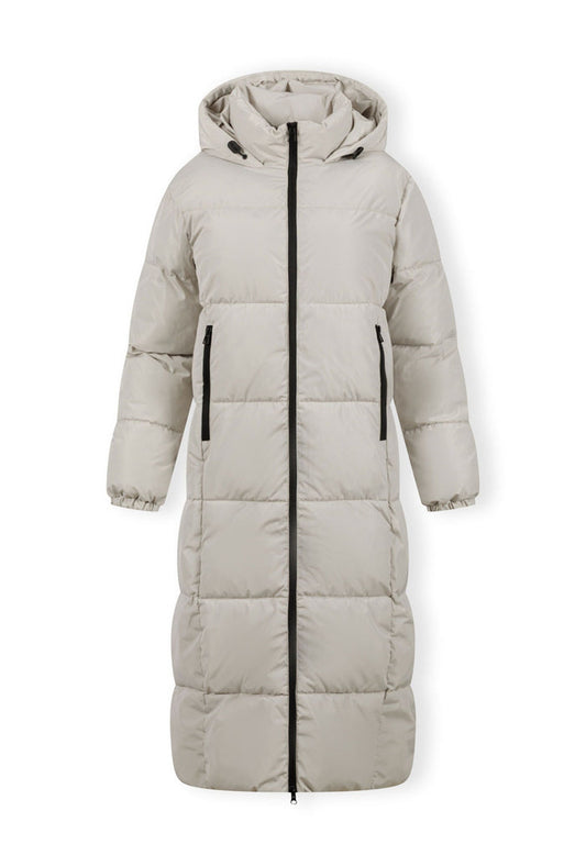 Long quilted winter jacket with drawstring hood, front zipper, and zipped pockets.