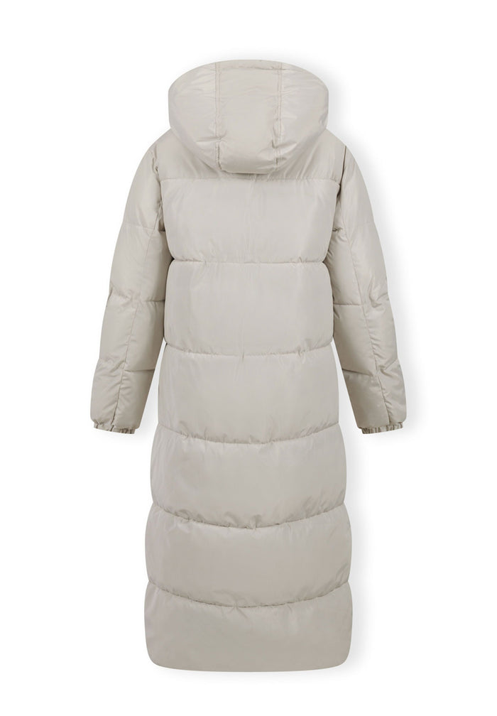 Back view of a long cream quilted winter jacket with a drawstring hood.