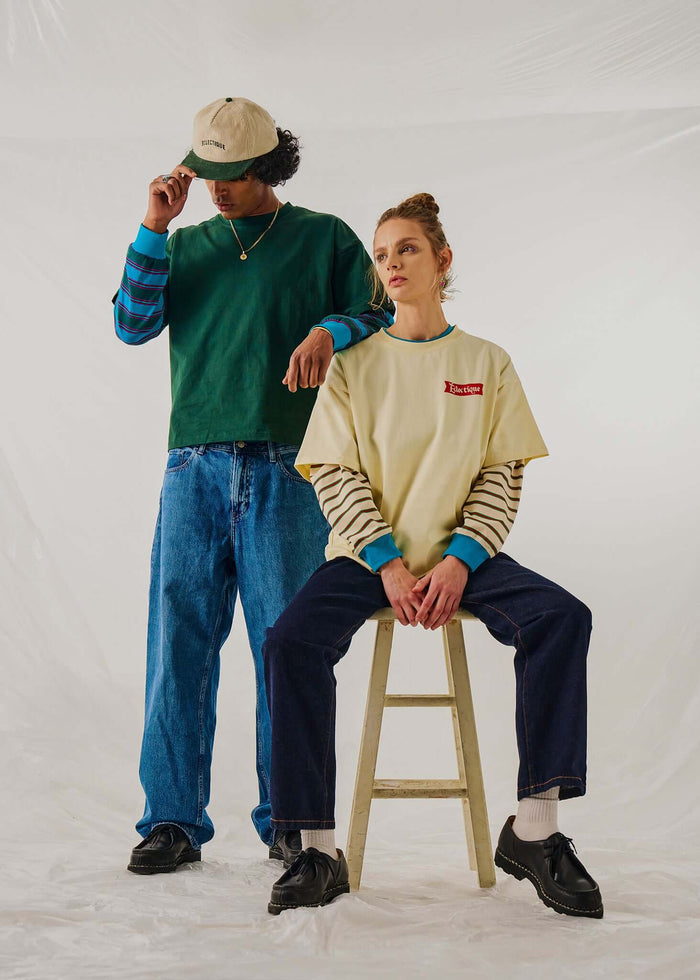 Two models wearing long sleeve t-shirts in casual styles, for a trendy long sleeve t-shirt look.