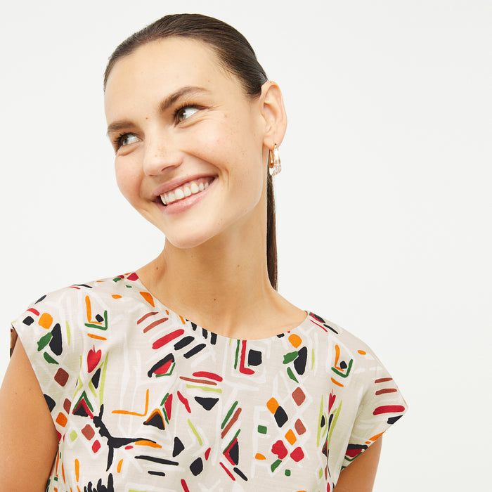 front image of a woman wearing the maaza dress in rhythm print