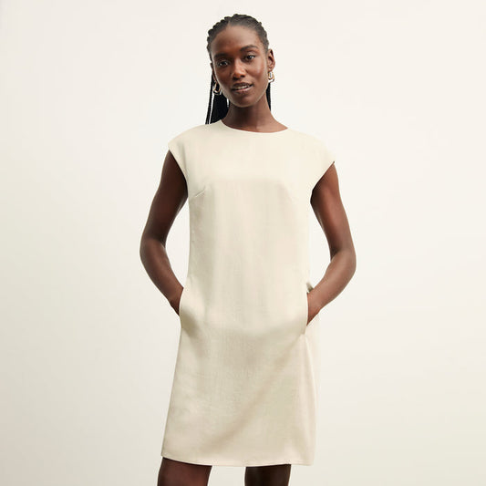 front image of a woman wearing the maaza dress in champagne | Lead