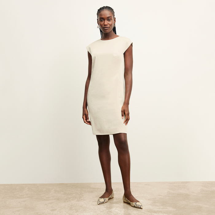 front image of a woman wearing the maaza dress in champagne