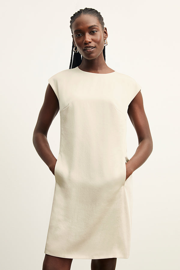 front image of a woman wearing the maaza dress in champagne | Exclude | Grid