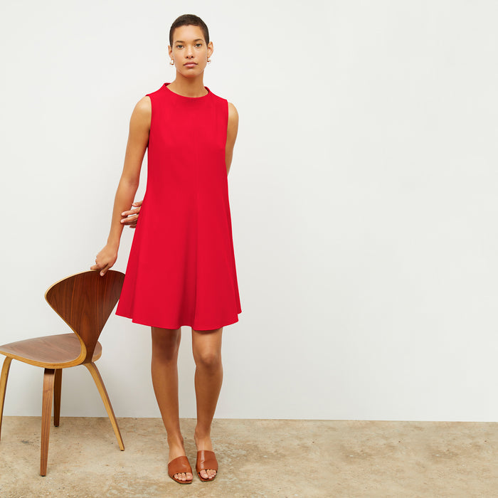 Front image of a woman wearing the malala dress in flame