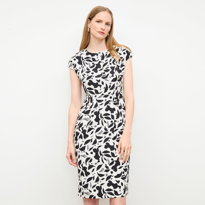 front image of a woman wearing the masha dress in icon print | Lead