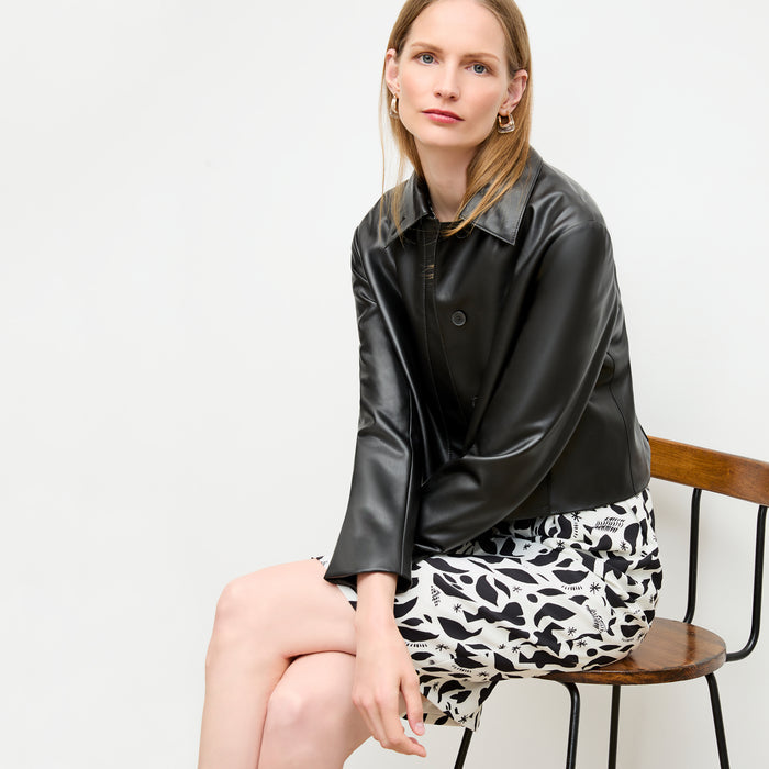 front image of a woman wearing the masha dress in icon print