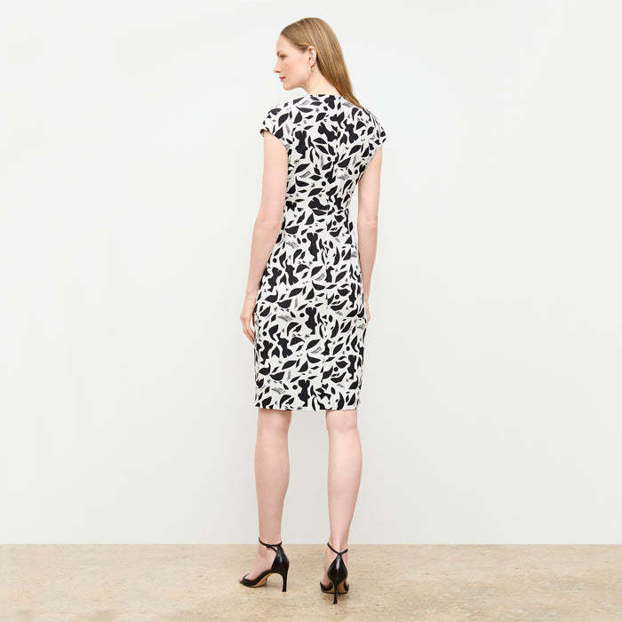 back image of a woman wearing the masha dress in icon print
