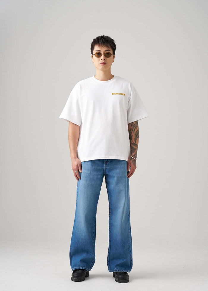 Men's Graphic T-shirt Paw Squad worn by a model in a modern casual outfit with stylish sunglasses.