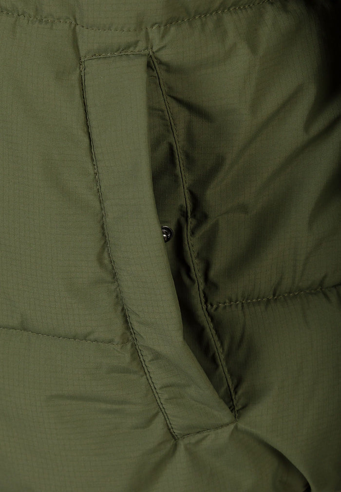 Detail of khaki men's ripstop jacket showing zippered pocket and fabric texture.