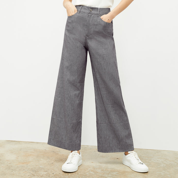 front image of a woman wearing the milo pant in gingham linen