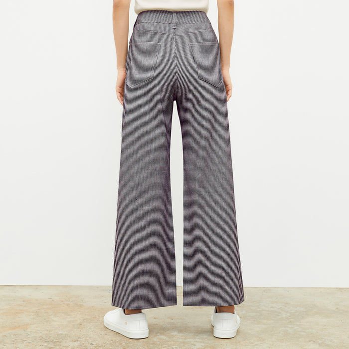 back image of a woman wearing the milo pant in gingham linen