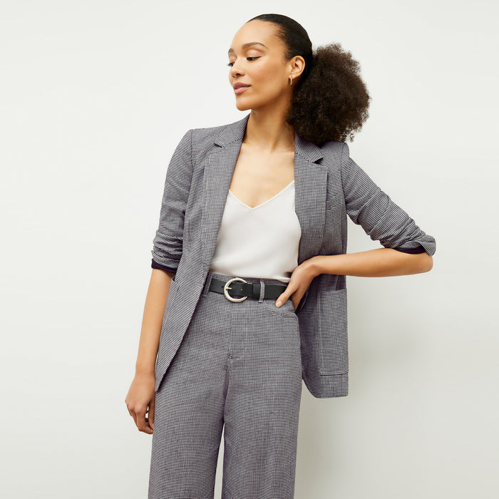 front image of a woman wearing the milo pant in gingham linen