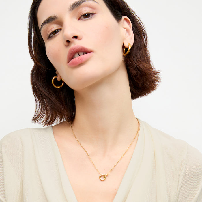 front image of a woman wearing the monica top in cream