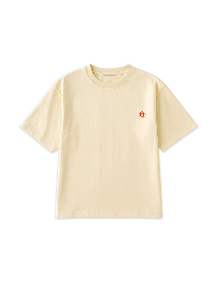 Monogram embroidered cotton t-shirt in French vanilla with embroidered monogram logo on left chest.