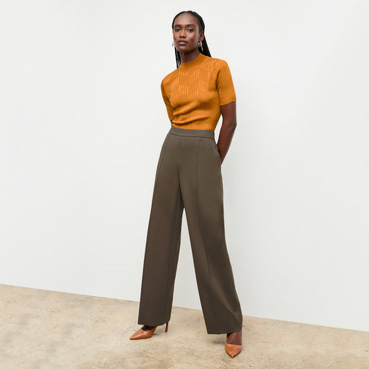 front image of a woman wearing the montean top in caramel | Lead