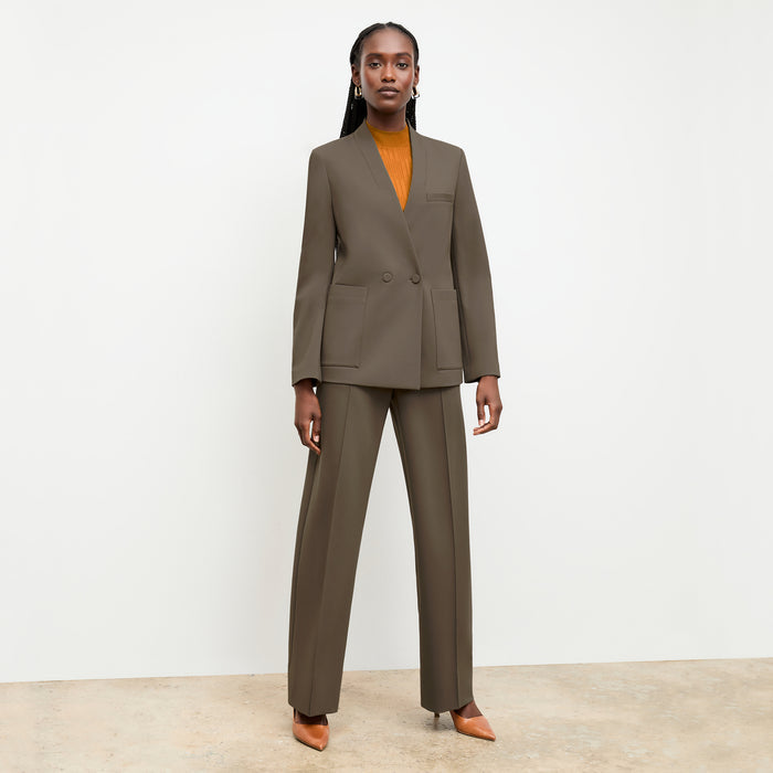 front image of a woman wearing the montean top in caramel