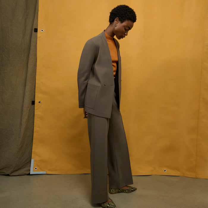 front image of a woman wearing the montean top in caramel