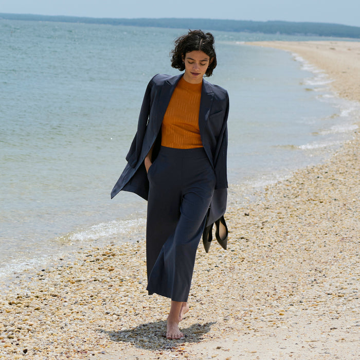 front image of a woman wearing the montean top in caramel