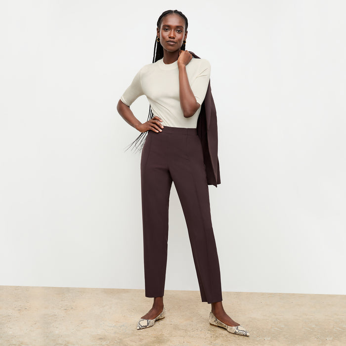 front image of a woman wearing the moreland jacket in wine over her shoulder