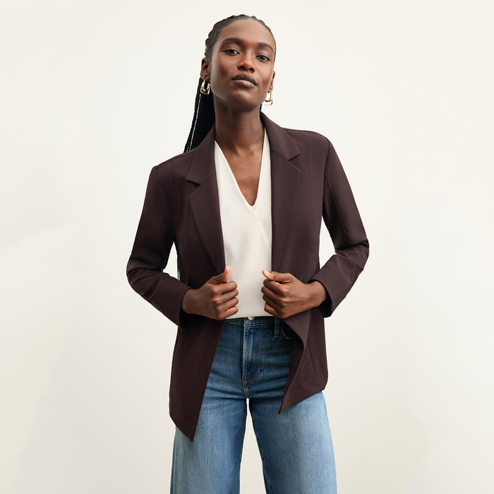 front image of a woman wearing the moreland jacket in wine over her shoulder