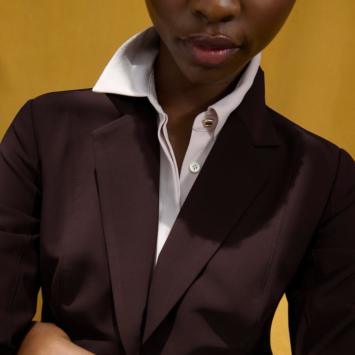 image of a woman wearing the moreland jacket in wine
