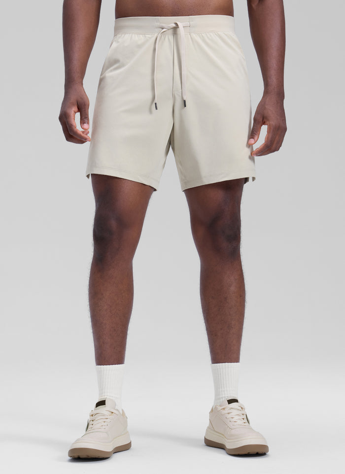 CRZ YOGA Men's Motion Workout Classic FIt Quick Dry Pocket Shorts  7" Mojave Tan