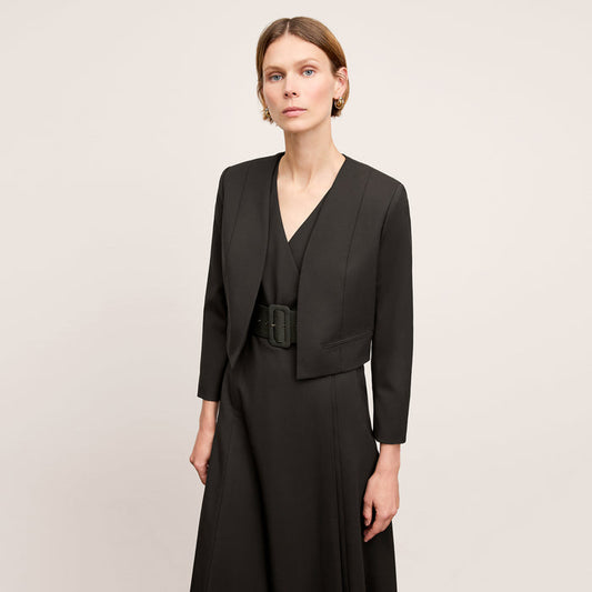 Front image of a woman standing wearing the Neale jacket in black | Lead