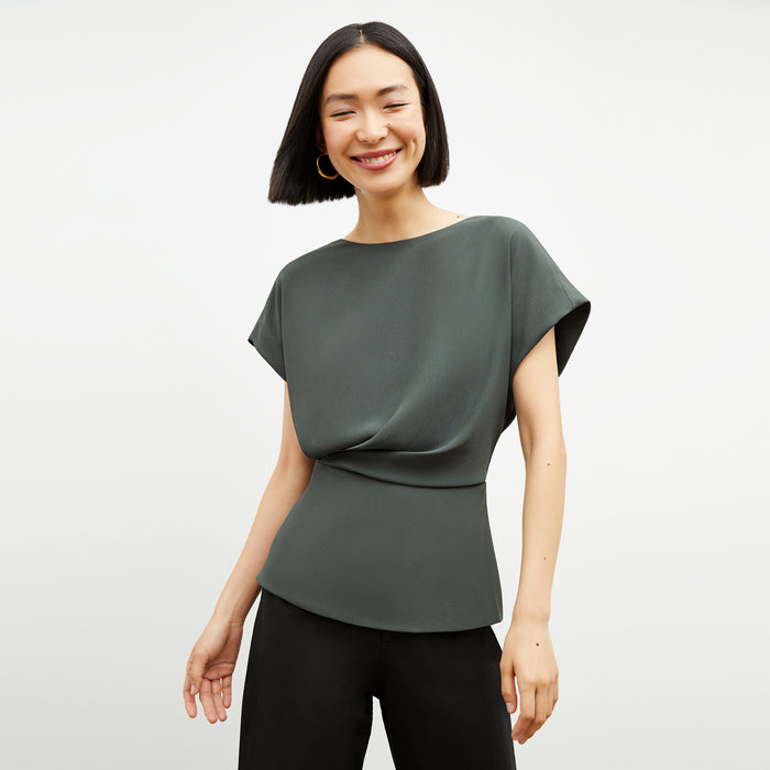 Front image of a woman wearing the Nejvi Top in Aloe | Lead