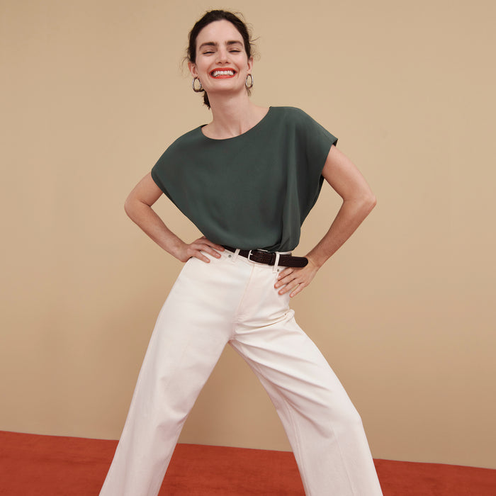 Front image of a woman wearing the Nejvi Top in Aloe