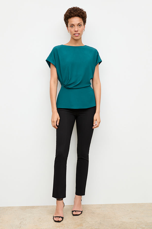 front image of a woman wearing the nejvi top in mineral blue | Exclude | Grid