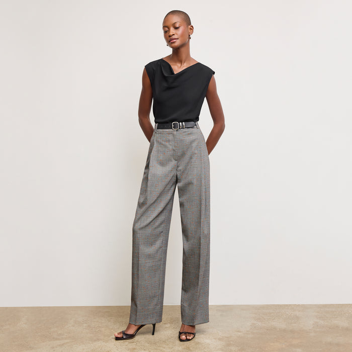 Front image of a woman wearing the Nora Top in Black