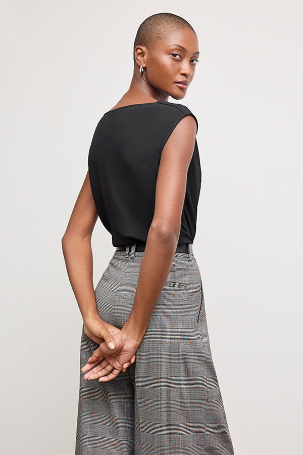 back image of a woman wearing the Nora Top in Black | Grid Hover | Exclude