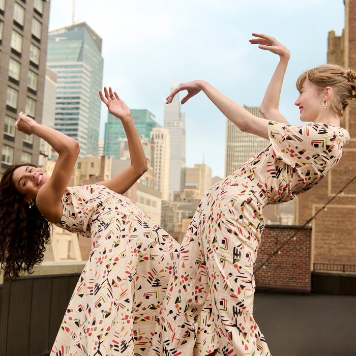 front image of a woman wearing the oona dress in rhythm print