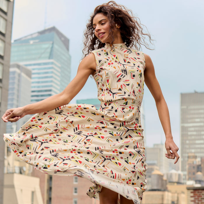 front image of a woman wearing the oona dress in rhythm print