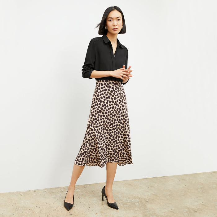 Front image of a woman wearing the orchard skirt in sahara print
