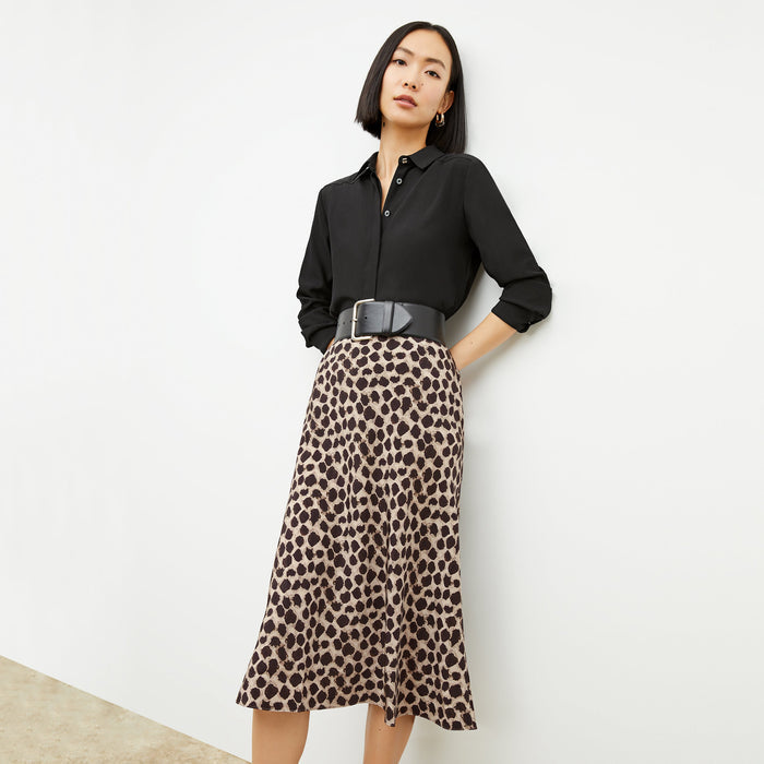Front image of a woman wearing the orchard skirt in sahara print
